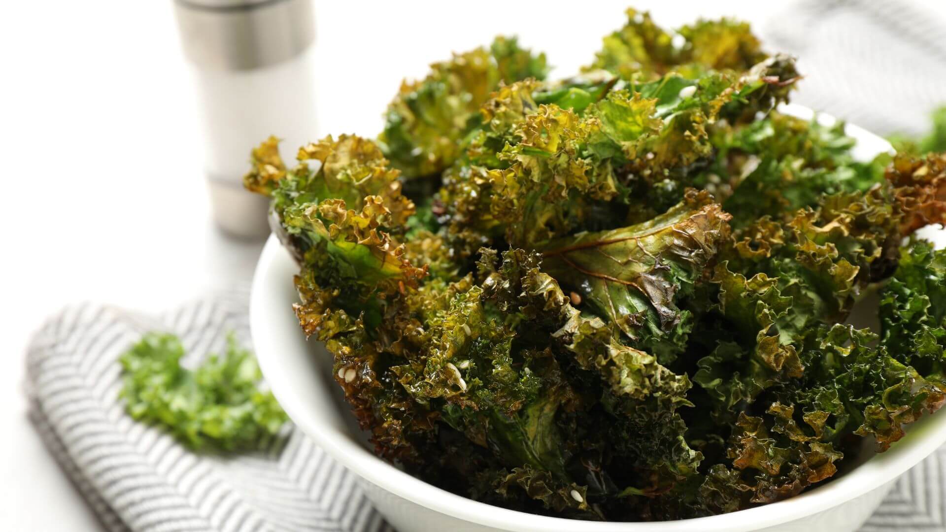 an image of baked leafy greeen in white bowl